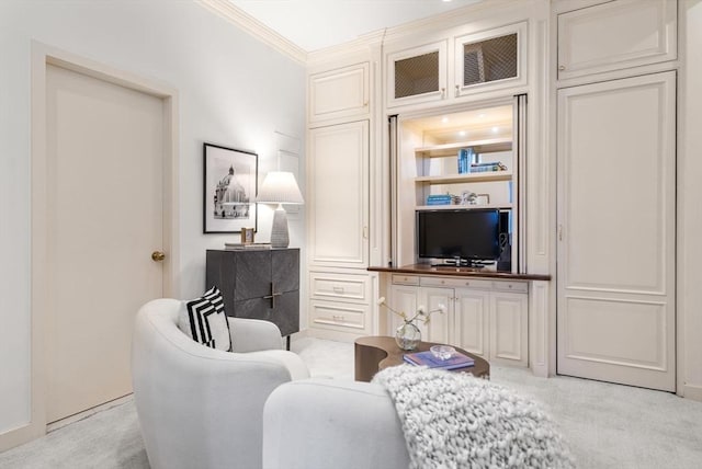 living area with crown molding and light carpet