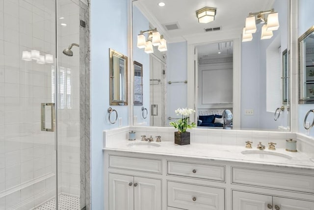 ensuite bathroom with visible vents, a sink, connected bathroom, and a shower stall