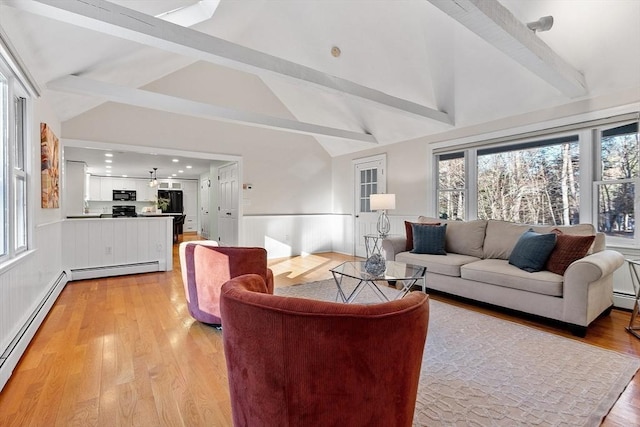 living room featuring light wood-type flooring, lofted ceiling with beams, and a baseboard radiator