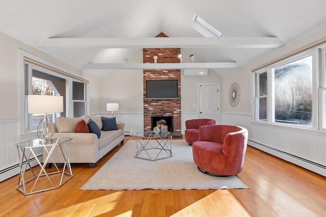 living room featuring a fireplace, lofted ceiling with beams, and a baseboard heating unit