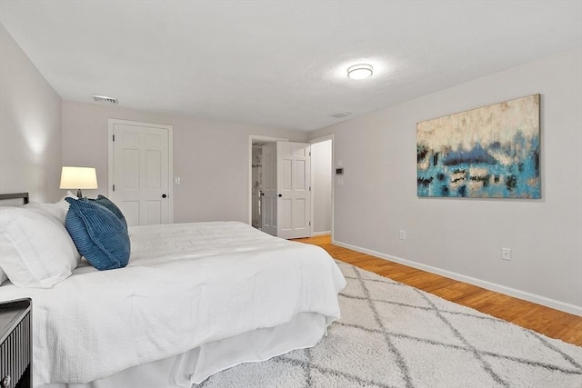 bedroom with hardwood / wood-style flooring