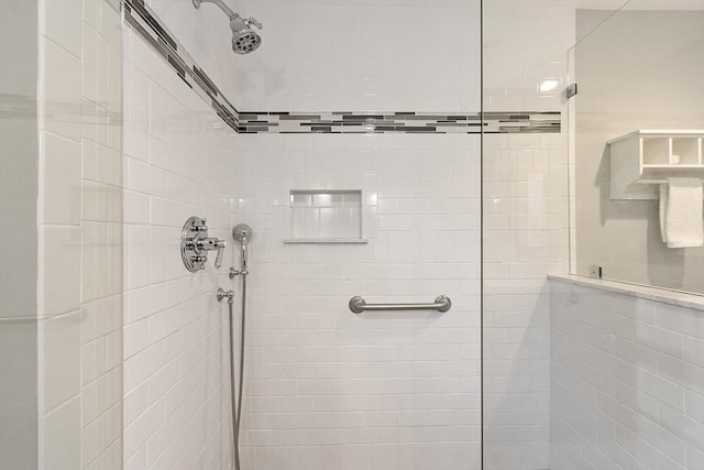 bathroom with tiled shower