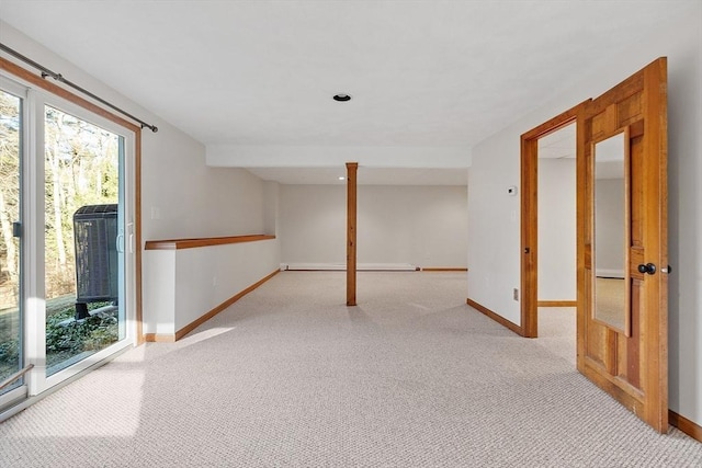 basement featuring light colored carpet