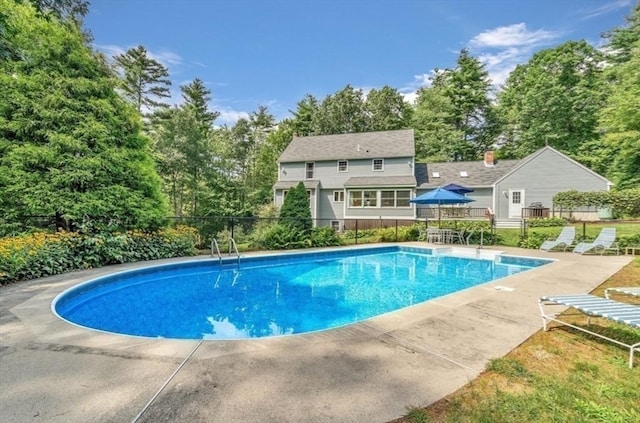 view of swimming pool featuring a patio area