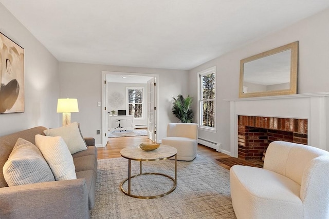 living room featuring hardwood / wood-style flooring and baseboard heating