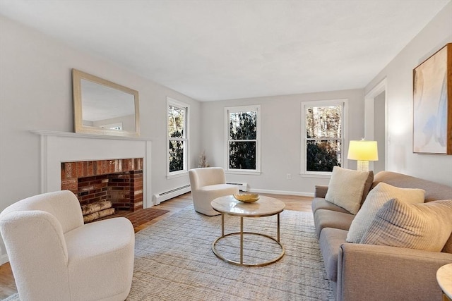 living room with hardwood / wood-style floors and a baseboard heating unit