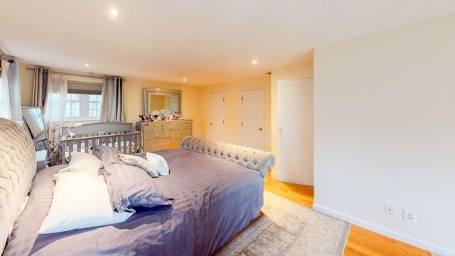 bedroom with light hardwood / wood-style flooring