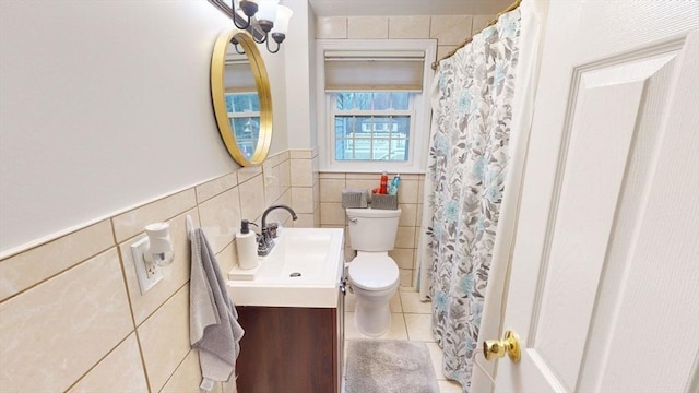 bathroom featuring toilet, tile patterned floors, and vanity