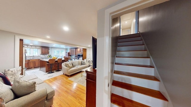 staircase with wood-type flooring