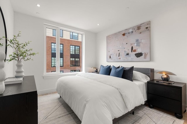 bedroom featuring baseboards and recessed lighting