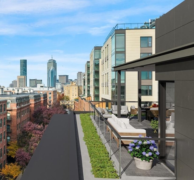 exterior space with a view of city and outdoor lounge area