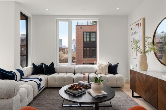 living area featuring light wood finished floors and recessed lighting