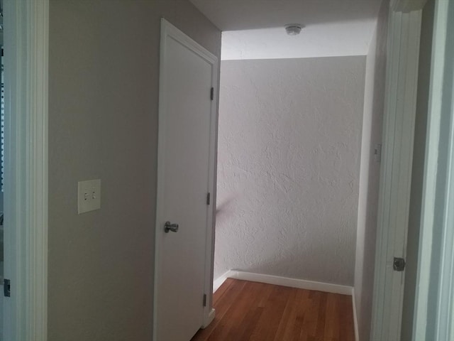 65 Reservoir St Unit 65, Holden, MA 01520 - hallway featuring wood finished floors, baseboards, and a textured wall