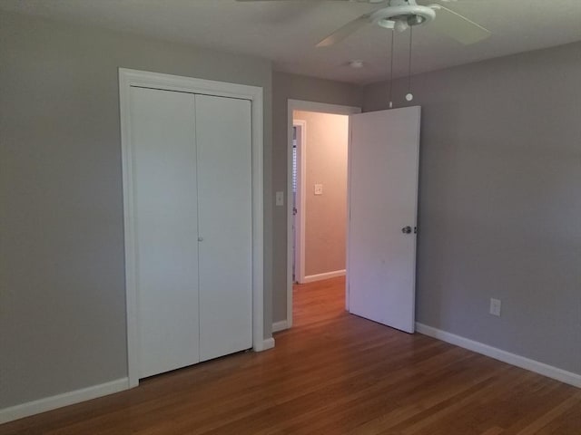 65 Reservoir St Unit 65, Holden, MA 01520 - unfurnished bedroom featuring wood finished floors, a closet, baseboards, and a ceiling fan