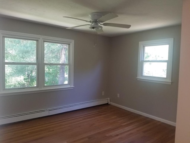 65 Reservoir St Unit 65, Holden, MA 01520 - unfurnished room featuring baseboard heating, dark wood finished floors, ceiling fan, and baseboards