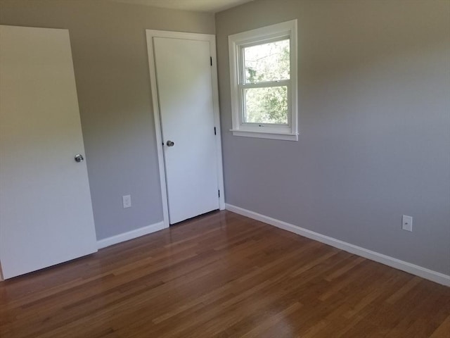 65 Reservoir St Unit 65, Holden, MA 01520 - unfurnished bedroom with wood finished floors and baseboards