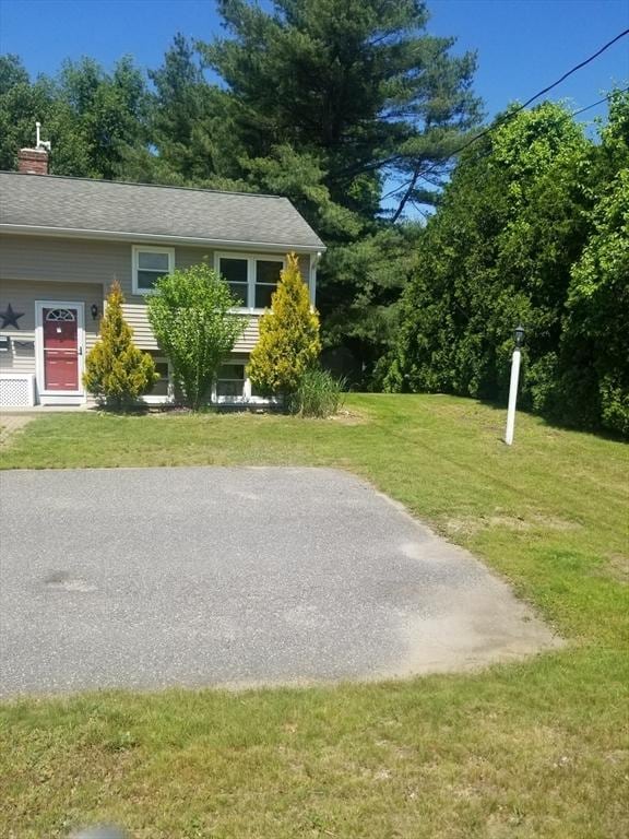 65 Reservoir St Unit 65, Holden, MA 01520 - view of front facade featuring a front yard and a chimney