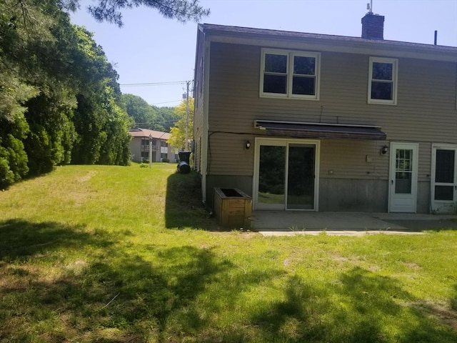 65 Reservoir St Unit 65, Holden, MA 01520 - back of house featuring a lawn, a chimney, and a patio area
