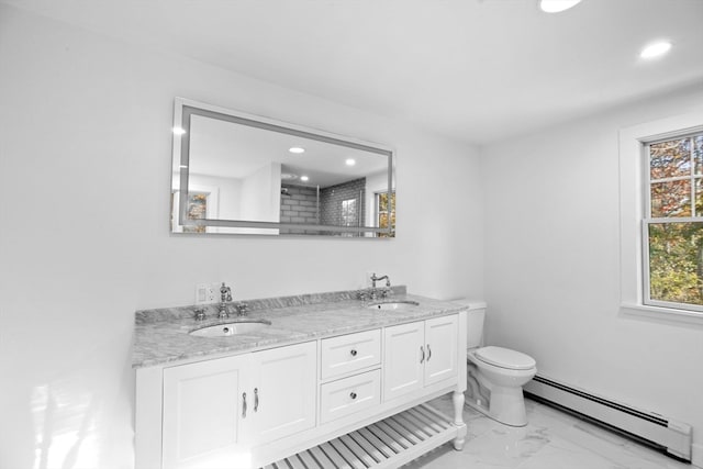 bathroom featuring vanity, toilet, and a baseboard heating unit