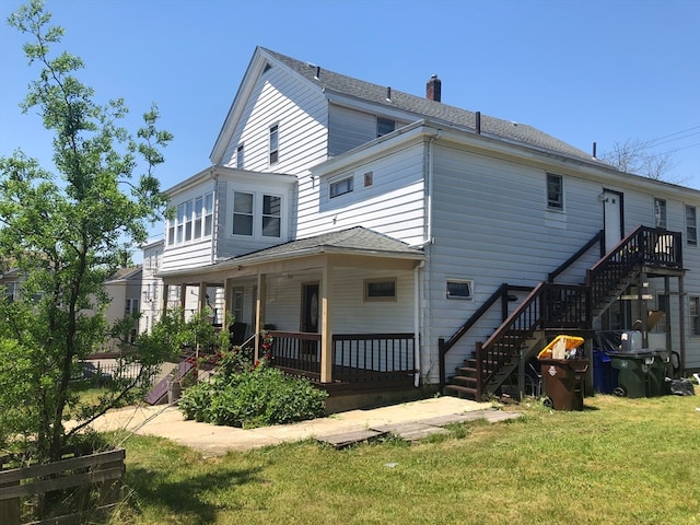 back of house featuring a yard