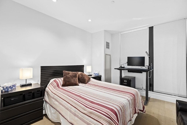 bedroom with light hardwood / wood-style flooring