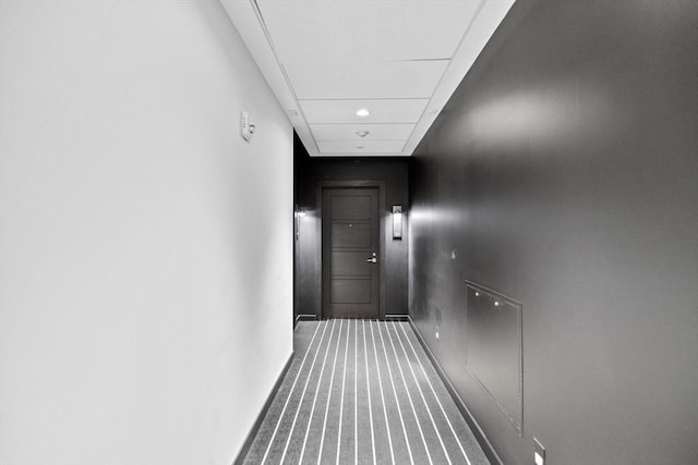 corridor with carpet flooring