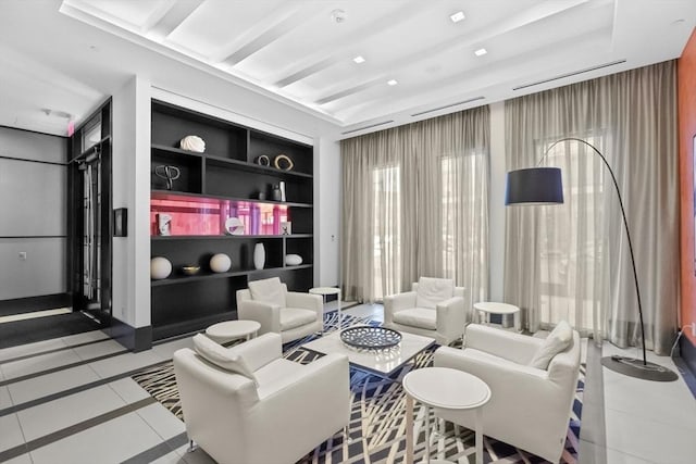 sitting room with built in shelves and tile patterned floors