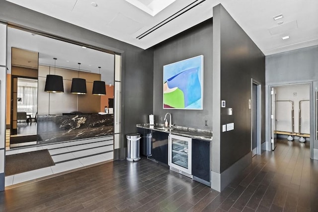 kitchen with pendant lighting, dark hardwood / wood-style floors, and wine cooler