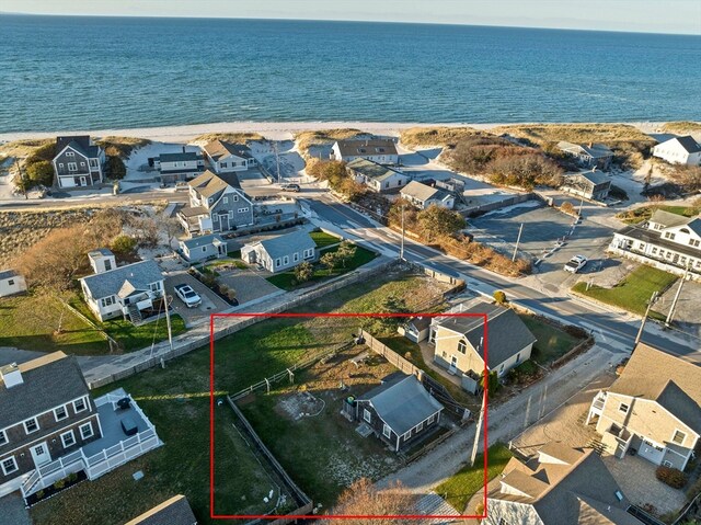 bird's eye view with a beach view and a water view