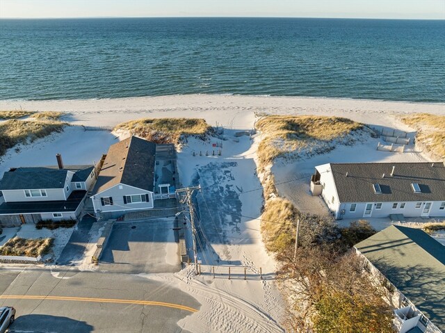 aerial view with a water view and a view of the beach