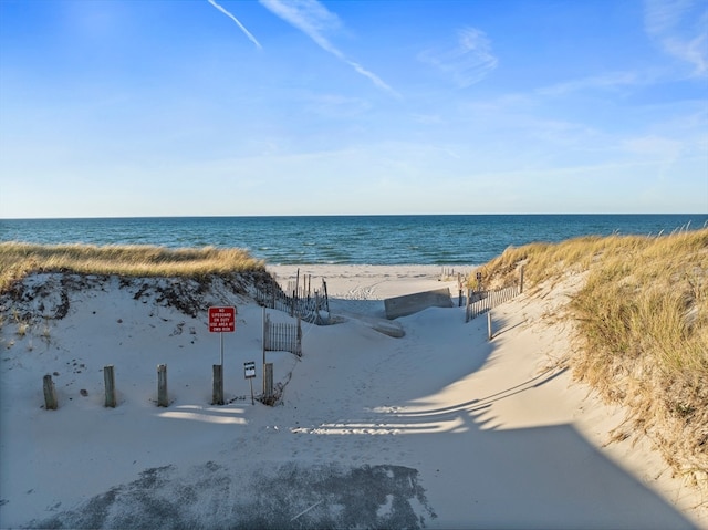 view of water feature with a beach view