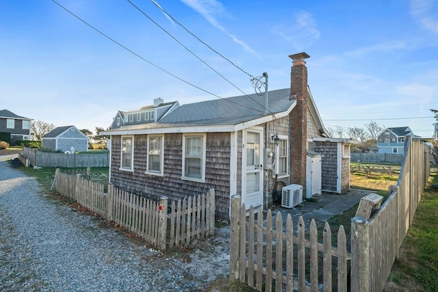 view of home's exterior with ac unit