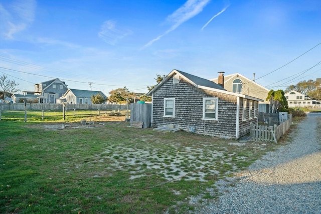 view of home's exterior with a lawn