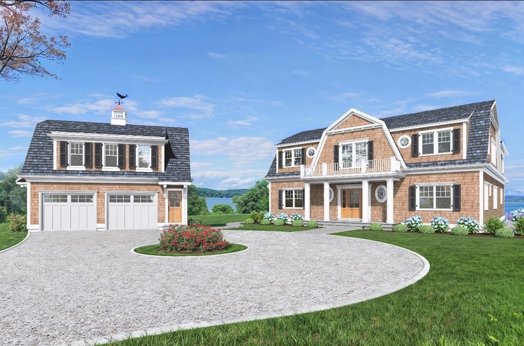 view of front of property with a porch, a front yard, and a garage