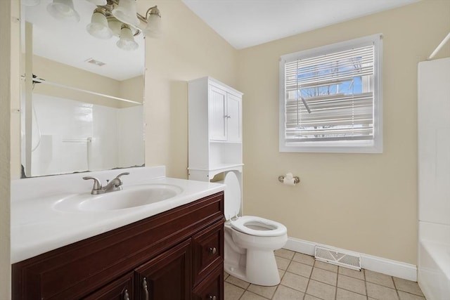 bathroom featuring visible vents, toilet, vanity, baseboards, and tile patterned floors