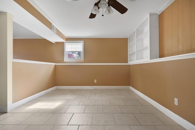 unfurnished room with ornamental molding, visible vents, ceiling fan, and baseboards