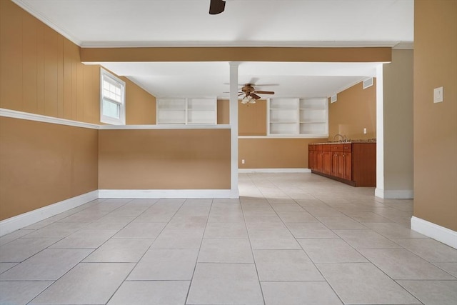 spare room featuring visible vents, ornamental molding, light tile patterned flooring, ceiling fan, and baseboards