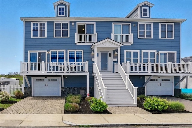 1089 Winthrop Ave Unit A, Revere, MA 02151 - beach home featuring an attached garage, decorative driveway, and stairway