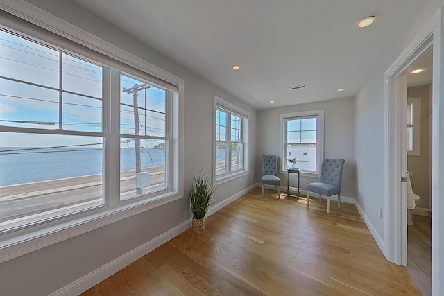 1089 Winthrop Ave Unit A, Revere, MA 02151 - living area with baseboards, light wood-type flooring, recessed lighting, and a water view