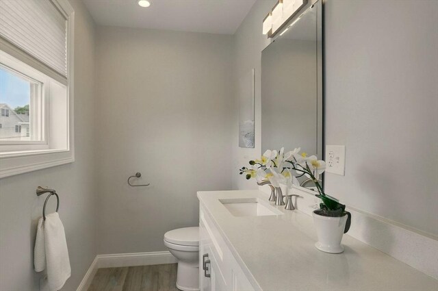 1089 Winthrop Ave Unit A, Revere, MA 02151 - bathroom with vanity, toilet, baseboards, wood finished floors, and recessed lighting