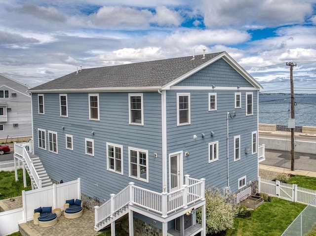 1089 Winthrop Ave Unit A, Revere, MA 02151 - rear view of house featuring a fenced backyard, a wooden deck, stairs, and a gate