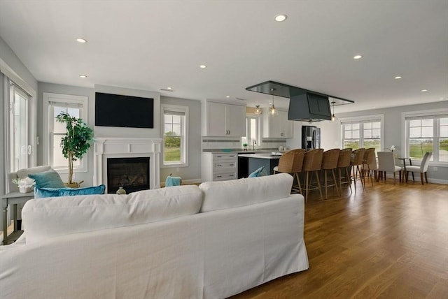 1089 Winthrop Ave Unit A, Revere, MA 02151 - living room featuring recessed lighting, dark wood-type flooring, a glass covered fireplace, and baseboards