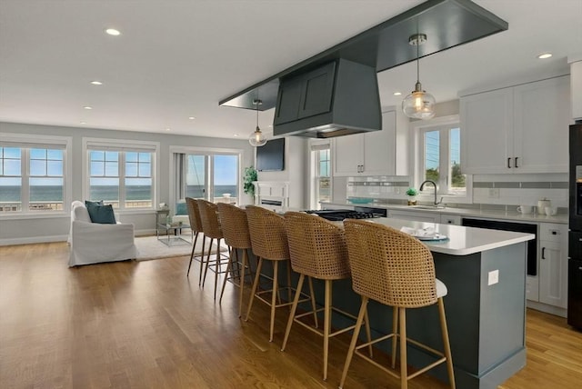 1089 Winthrop Ave Unit A, Revere, MA 02151 - kitchen with healthy amount of natural light, open floor plan, a center island, recessed lighting, and tasteful backsplash