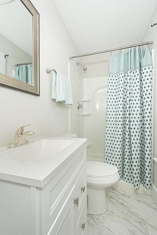 29 Maple St Unit 2, Uxbridge, MA 01569 - bathroom with vanity, a shower with curtain, vaulted ceiling, and marble finish flooring