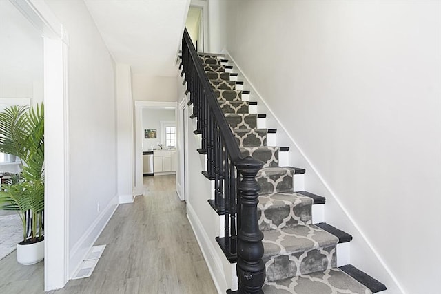 29 Maple St Unit 2, Uxbridge, MA 01569 - stairway featuring wood finished floors and baseboards