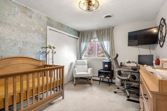 40 Fowler Ave, Revere, MA 02151 - carpeted bedroom with a desk, a closet, and a textured ceiling