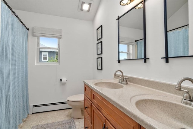 40 Fowler Ave, Revere, MA 02151 - bathroom featuring baseboard heating, double vanity, toilet, and plenty of natural light