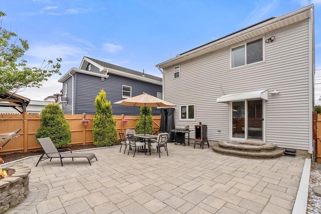 40 Fowler Ave, Revere, MA 02151 - back of house featuring a patio and outdoor dining area