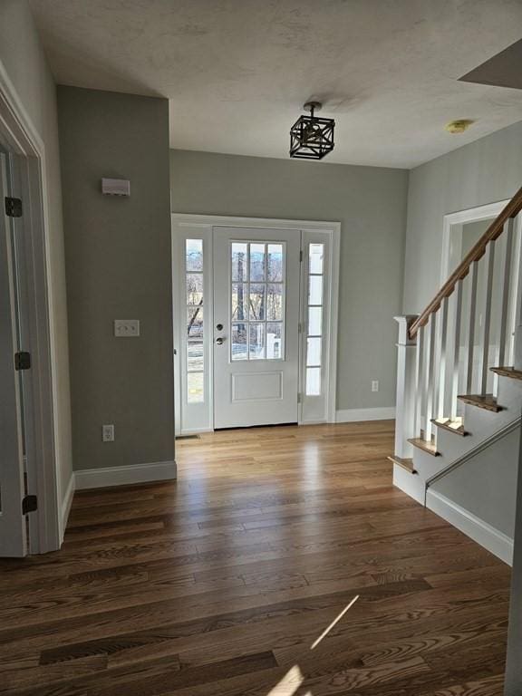 foyer with dark hardwood / wood-style flooring