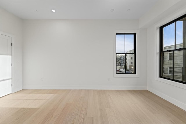 empty room with light wood-type flooring